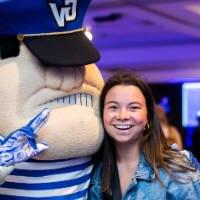 A grad with Louie the Laker.